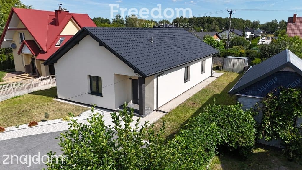 Nowoczesny dom parterowy z klimatycznym tarasem - zdjęcie 10