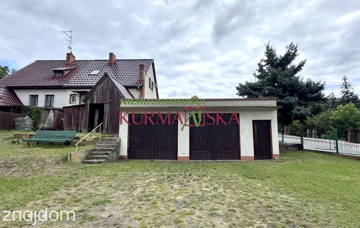 Dom bliźniak z budynkiem stacji diagnostyki samoch